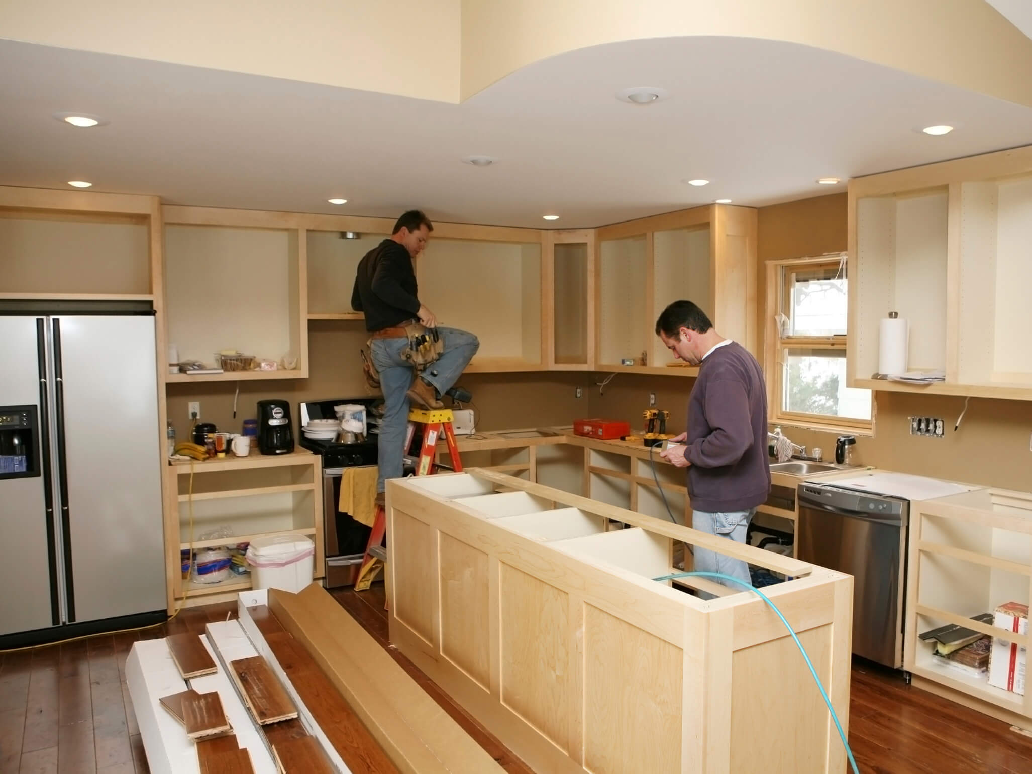 Hawaii home with contractors renovating kitchen